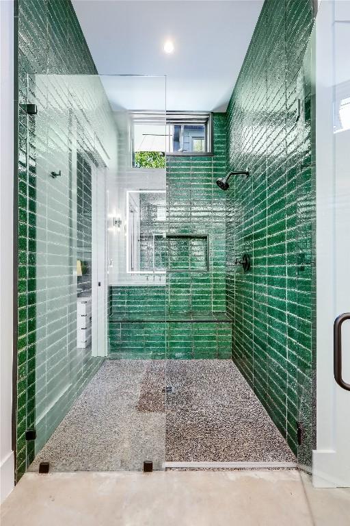 full bathroom with tiled shower
