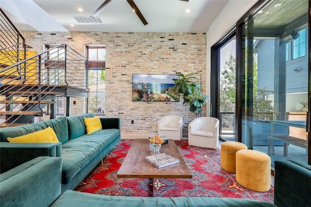 community lobby featuring visible vents and stairway