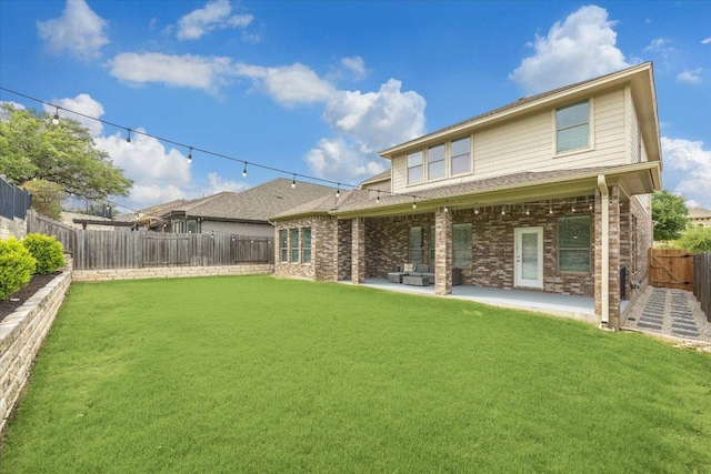 2216 Lookout Knoll Dr, Leander, TX 78641 - rear view of house with a patio area and brick siding
