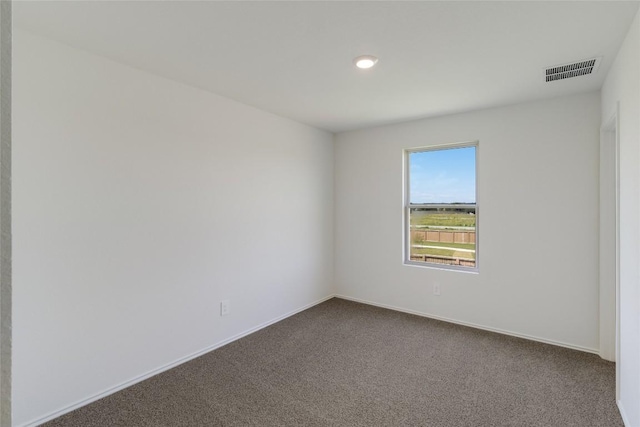 175 Safflower Dr, Uhland, TX 78640 - unfurnished room featuring dark colored carpet and recessed lighting