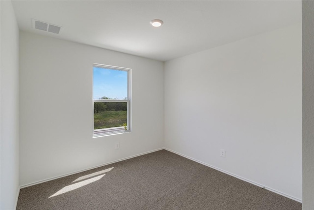 175 Safflower Dr, Uhland, TX 78640 - empty room featuring dark carpet and baseboards