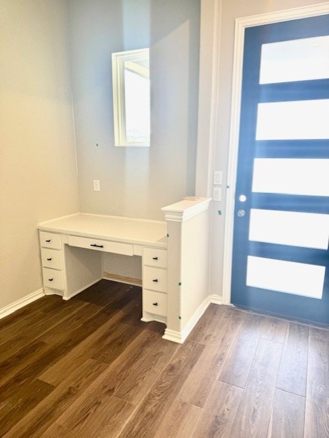 1155 Roger Hanks Pkwy, Dripping Springs, TX 78620 - foyer with built in desk and dark wood-style floors