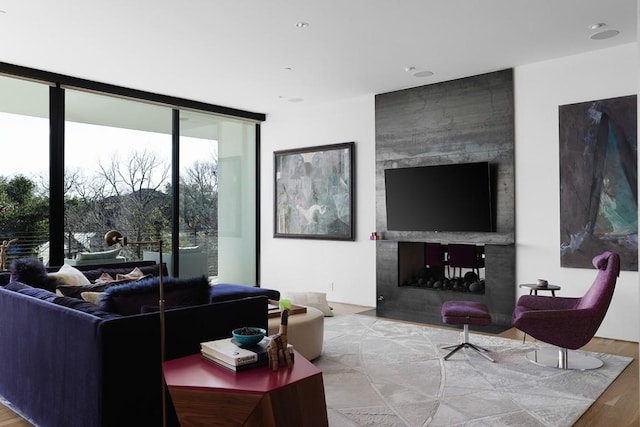 4607 Laurel Canyon Dr, Austin, TX 78731 - living area with floor to ceiling windows, wood finished floors, and a multi sided fireplace
