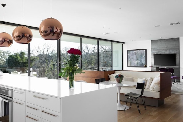 4607 Laurel Canyon Dr, Austin, TX 78731 - living area featuring wood finished floors and floor to ceiling windows