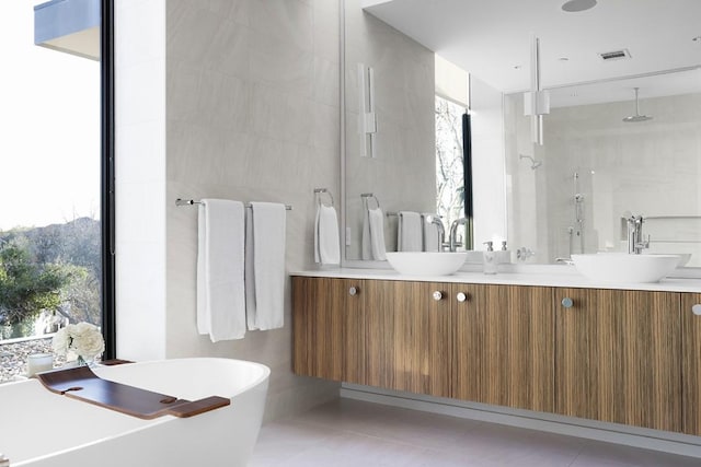 4607 Laurel Canyon Dr, Austin, TX 78731 - full bathroom featuring double vanity, a stall shower, and a freestanding tub