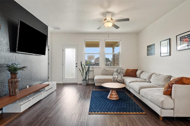 living room with a ceiling fan and wood finished floors