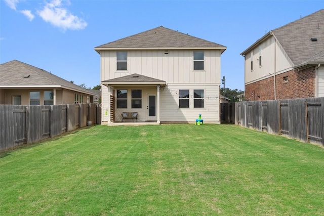 back of house featuring a patio area and board and batten siding