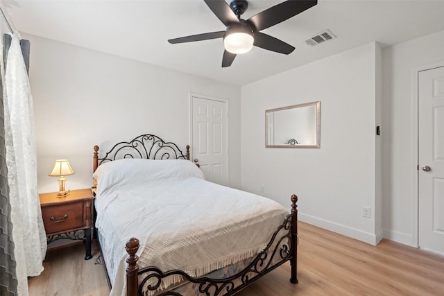 11604 Gaelic Dr, Austin, TX 78754 - bedroom with light wood finished floors and a ceiling fan