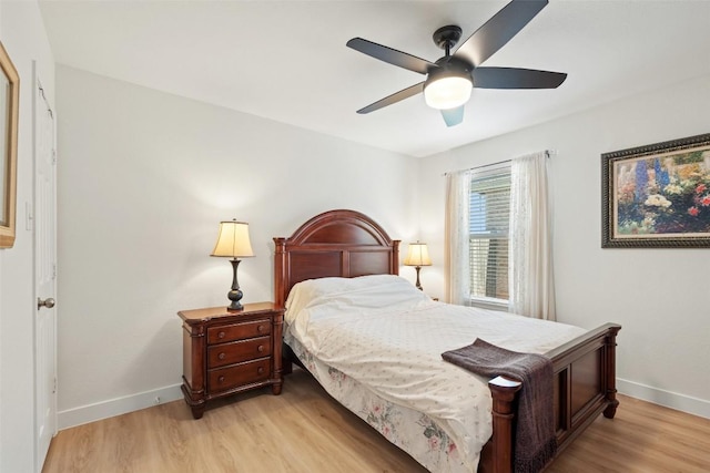 11604 Gaelic Dr, Austin, TX 78754 - bedroom with light wood finished floors and ceiling fan