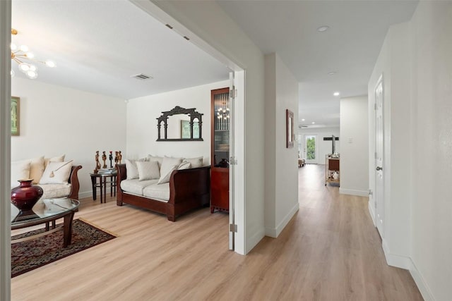 11604 Gaelic Dr, Austin, TX 78754 - living area with light wood-style flooring, a chandelier, and recessed lighting