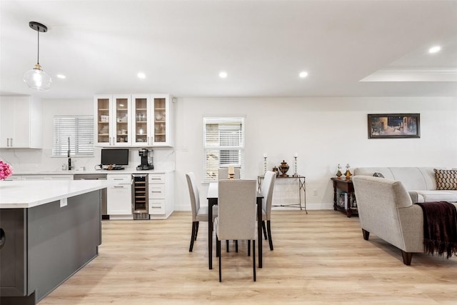 11604 Gaelic Dr, Austin, TX 78754 - dining area with beverage cooler, recessed lighting, and light wood finished floors