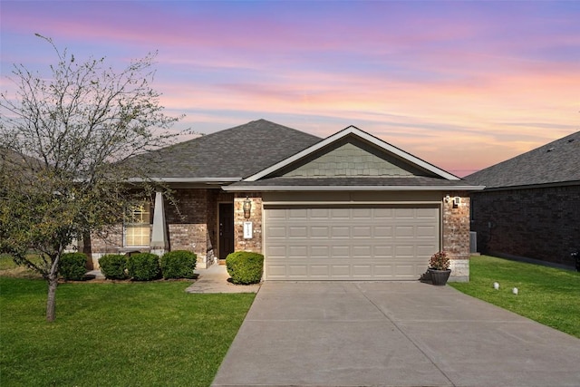 11604 Gaelic Dr, Austin, TX 78754 - ranch-style house featuring an attached garage, driveway, a lawn, brick siding, and a shingled roof