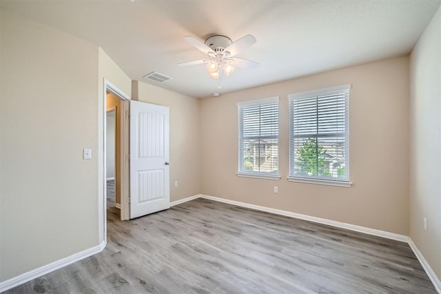 1432 Blake St, Leander, TX 78641 - unfurnished bedroom featuring wood finished floors, baseboards, and ceiling fan