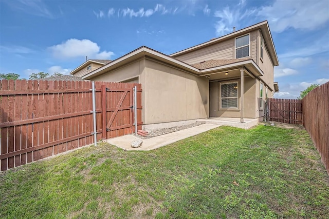 1432 Blake St, Leander, TX 78641 - rear view of property featuring a gate, stucco siding, and roof with shingles