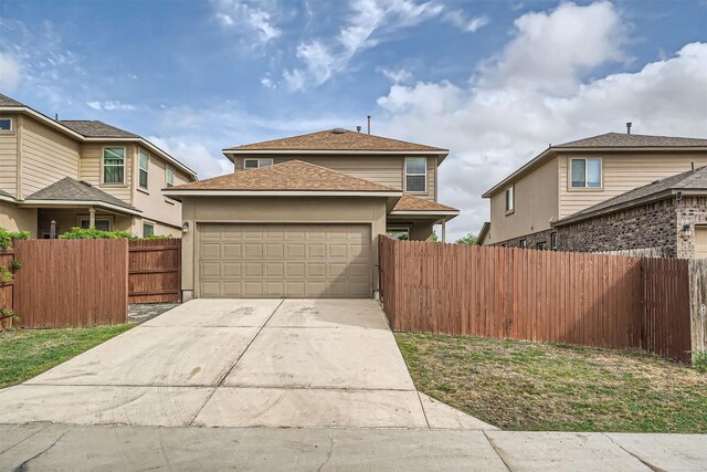 1432 Blake St, Leander, TX 78641 - traditional home featuring an attached garage, driveway, and a shingled roof