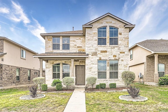 1432 Blake St, Leander, TX 78641 - view of front of property with stone siding, a front lawn, and a shingled roof