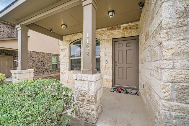 1432 Blake St, Leander, TX 78641 - property entrance with stone siding and a porch