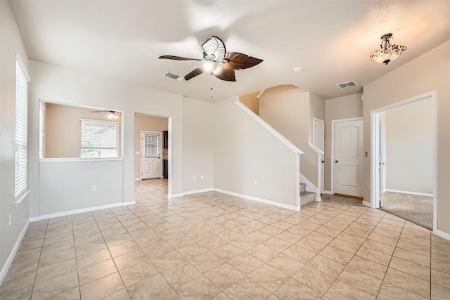 1432 Blake St, Leander, TX 78641 - unfurnished living room featuring a ceiling fan, stairs, and light tile patterned flooring