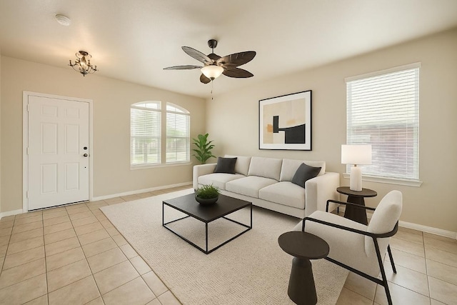 1432 Blake St, Leander, TX 78641 - living room with light tile patterned floors, baseboards, and ceiling fan