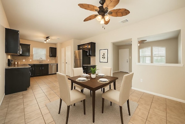 1432 Blake St, Leander, TX 78641 - dining space featuring a ceiling fan, light tile patterned floors, and baseboards
