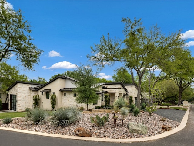 9806 Inca Ln, Austin, TX 78733 - view of front facade featuring stone siding and stucco siding