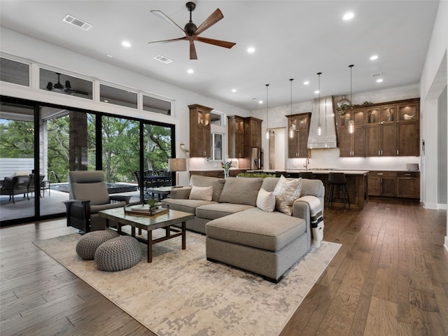 9806 Inca Ln, Austin, TX 78733 - living area with ceiling fan, dark wood-style floors, and recessed lighting