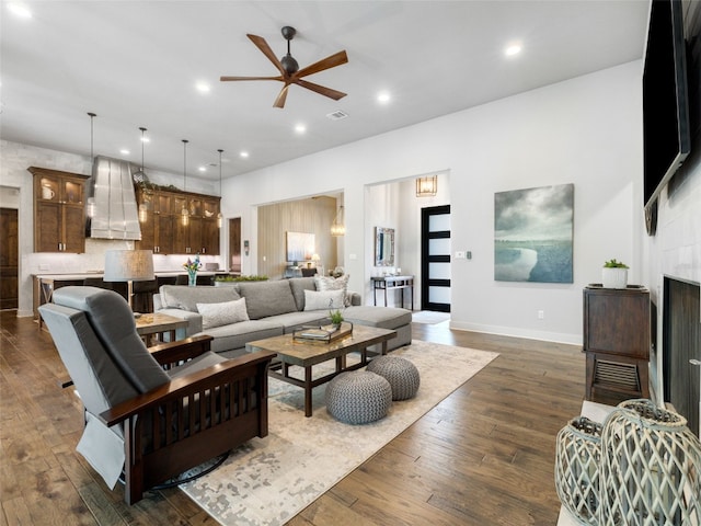 9806 Inca Ln, Austin, TX 78733 - living room with a ceiling fan, dark wood finished floors, recessed lighting, and a tile fireplace