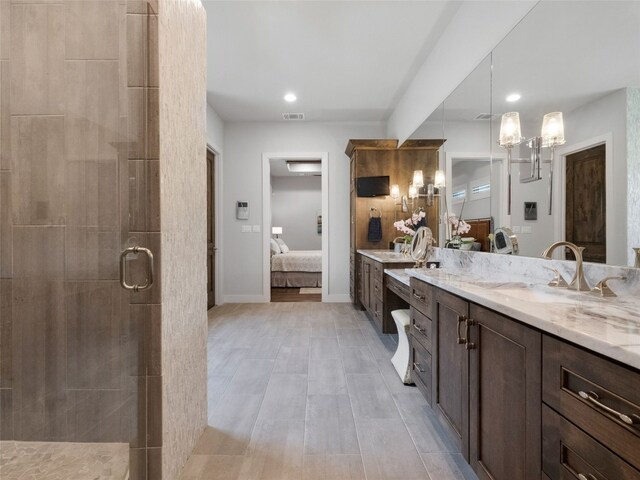 9806 Inca Ln, Austin, TX 78733 - full bath featuring connected bathroom, a stall shower, vanity, recessed lighting, and wood finished floors
