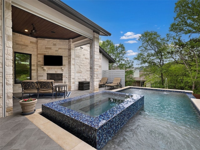9806 Inca Ln, Austin, TX 78733 - outdoor pool with a patio area, an in-ground hot tub, a ceiling fan, and an outdoor living space with a fireplace