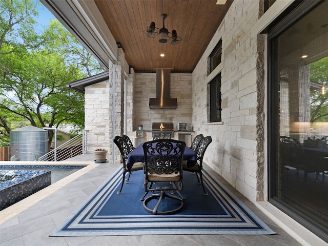 9806 Inca Ln, Austin, TX 78733 - view of patio featuring an outdoor stone fireplace and grilling area