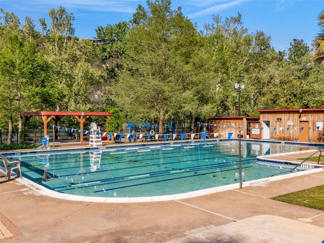 9806 Inca Ln, Austin, TX 78733 - community pool featuring view of scattered trees and a patio area