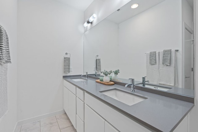 705 N Bluff Dr Unit 14, Austin, TX 78745 - bathroom with double vanity and marble finish flooring