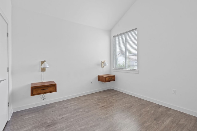 705 N Bluff Dr Unit 14, Austin, TX 78745 - spare room with lofted ceiling and wood finished floors