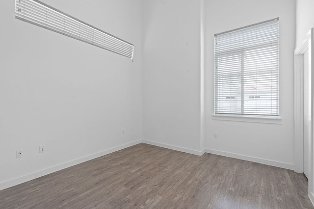 705 N Bluff Dr Unit 14, Austin, TX 78745 - spare room with wood finished floors and baseboards