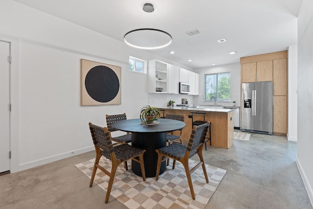 705 N Bluff Dr Unit 14, Austin, TX 78745 - dining area featuring concrete floors and recessed lighting