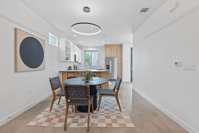 705 N Bluff Dr Unit 14, Austin, TX 78745 - dining room with concrete floors and baseboards