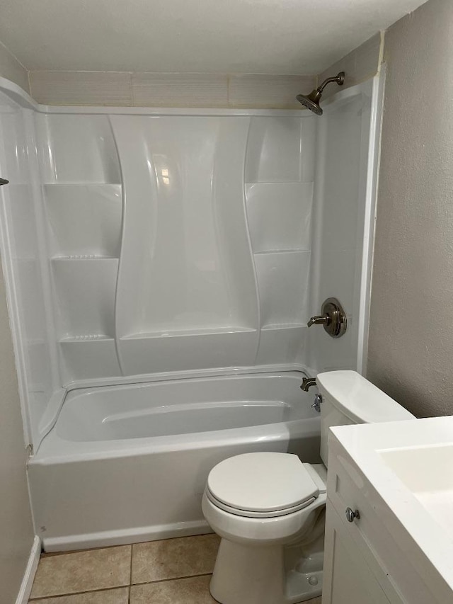 full bathroom with toilet, vanity, tile patterned floors, and tub / shower combination