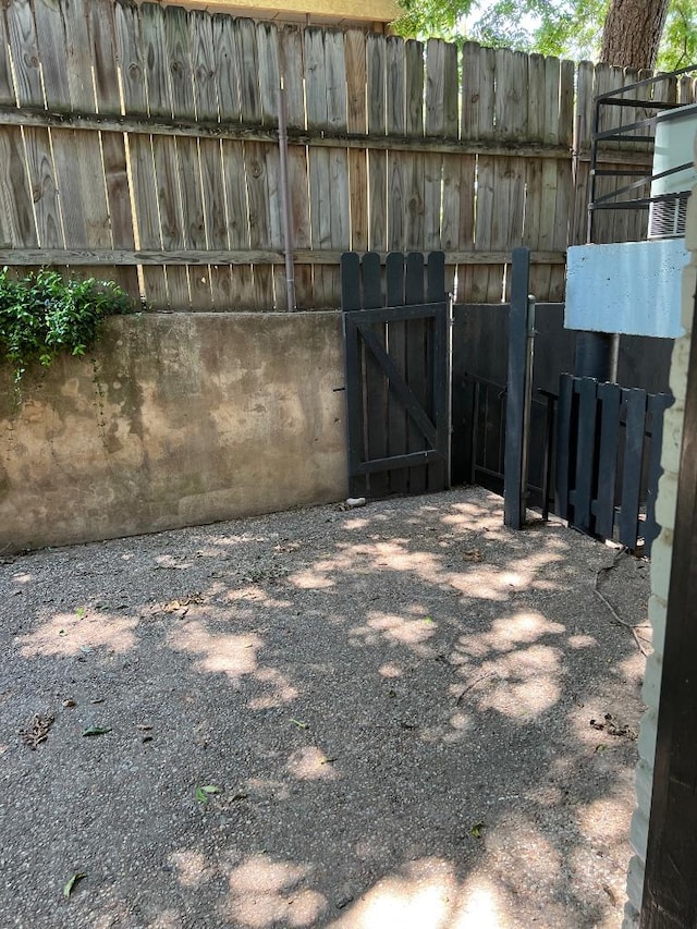 view of yard featuring a gate and fence