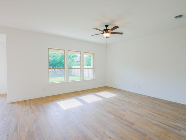 1705 Cayuga St, Leander, TX 78641 - unfurnished room featuring light wood-style floors, ceiling fan, and baseboards