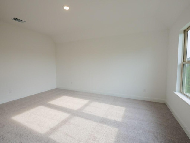 1705 Cayuga St, Leander, TX 78641 - spare room with light colored carpet, recessed lighting, and lofted ceiling