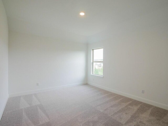 1705 Cayuga St, Leander, TX 78641 - empty room featuring light colored carpet and recessed lighting
