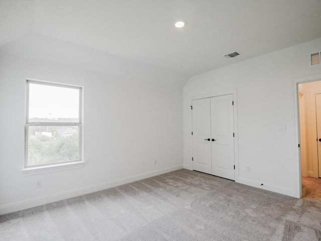 1705 Cayuga St, Leander, TX 78641 - unfurnished bedroom featuring carpet, vaulted ceiling, baseboards, recessed lighting, and a closet