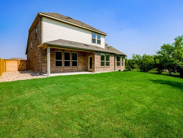 1705 Cayuga St, Leander, TX 78641 - rear view of house featuring a fenced backyard, brick siding, and a patio area