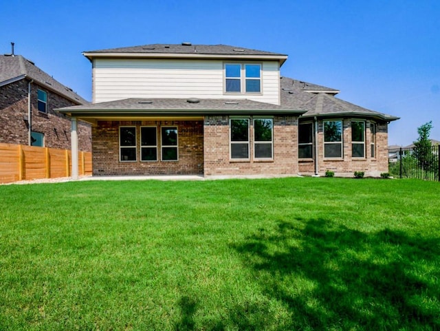 1705 Cayuga St, Leander, TX 78641 - back of house featuring brick siding and a patio area
