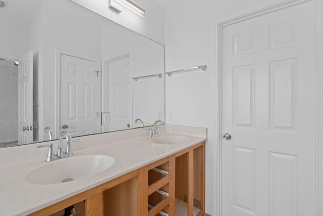 full bathroom featuring visible vents, a sink, and double vanity