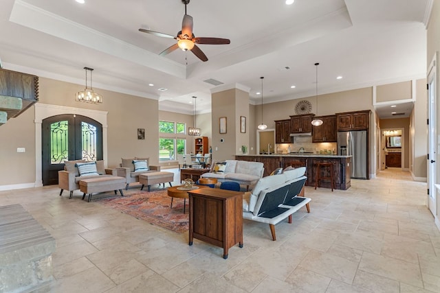 living area featuring stone tile floors, visible vents, and recessed lighting