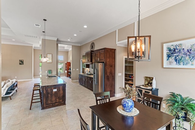 dining room featuring visible vents, recessed lighting, a chandelier, and crown molding