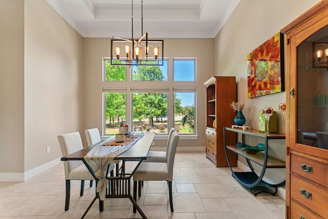 dining area featuring light tile patterned floors, a notable chandelier, crown molding, and a raised ceiling