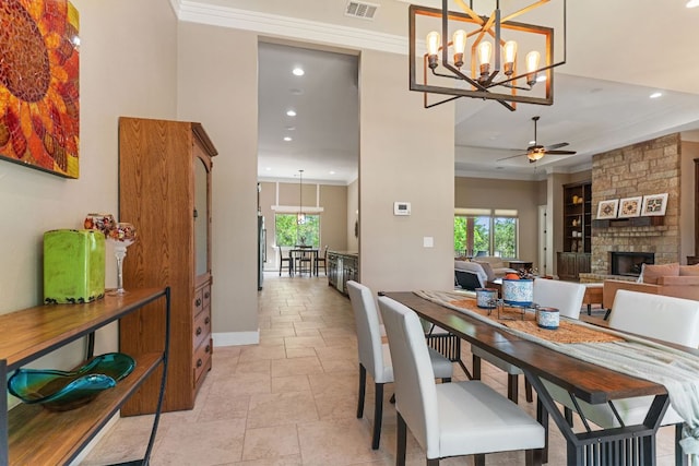 dining room with a wealth of natural light, ceiling fan with notable chandelier, visible vents, and recessed lighting