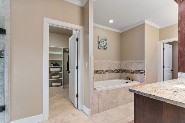 full bathroom with recessed lighting, vanity, ornamental molding, a walk in closet, and a garden tub